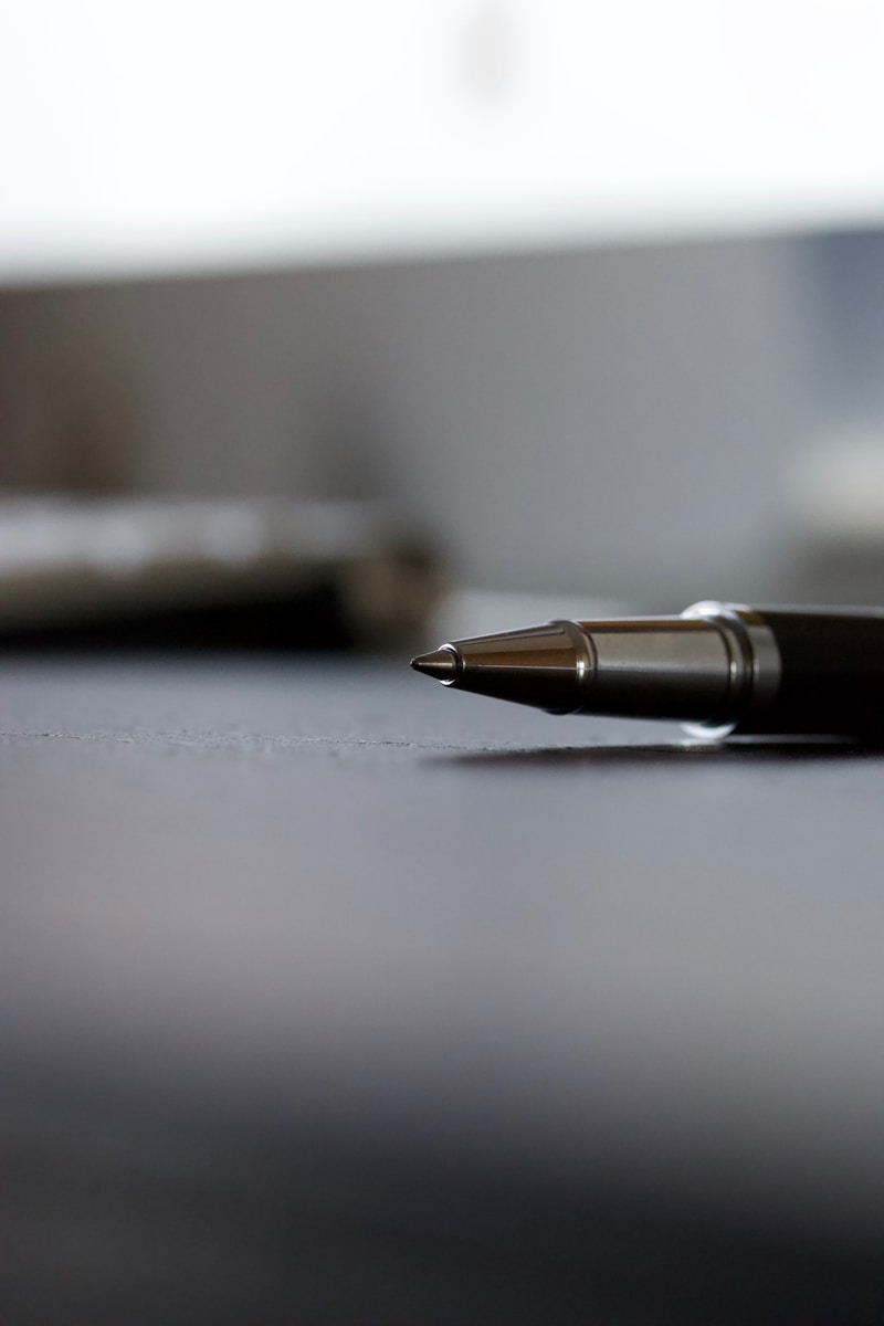 Photo by michael podger black click pen